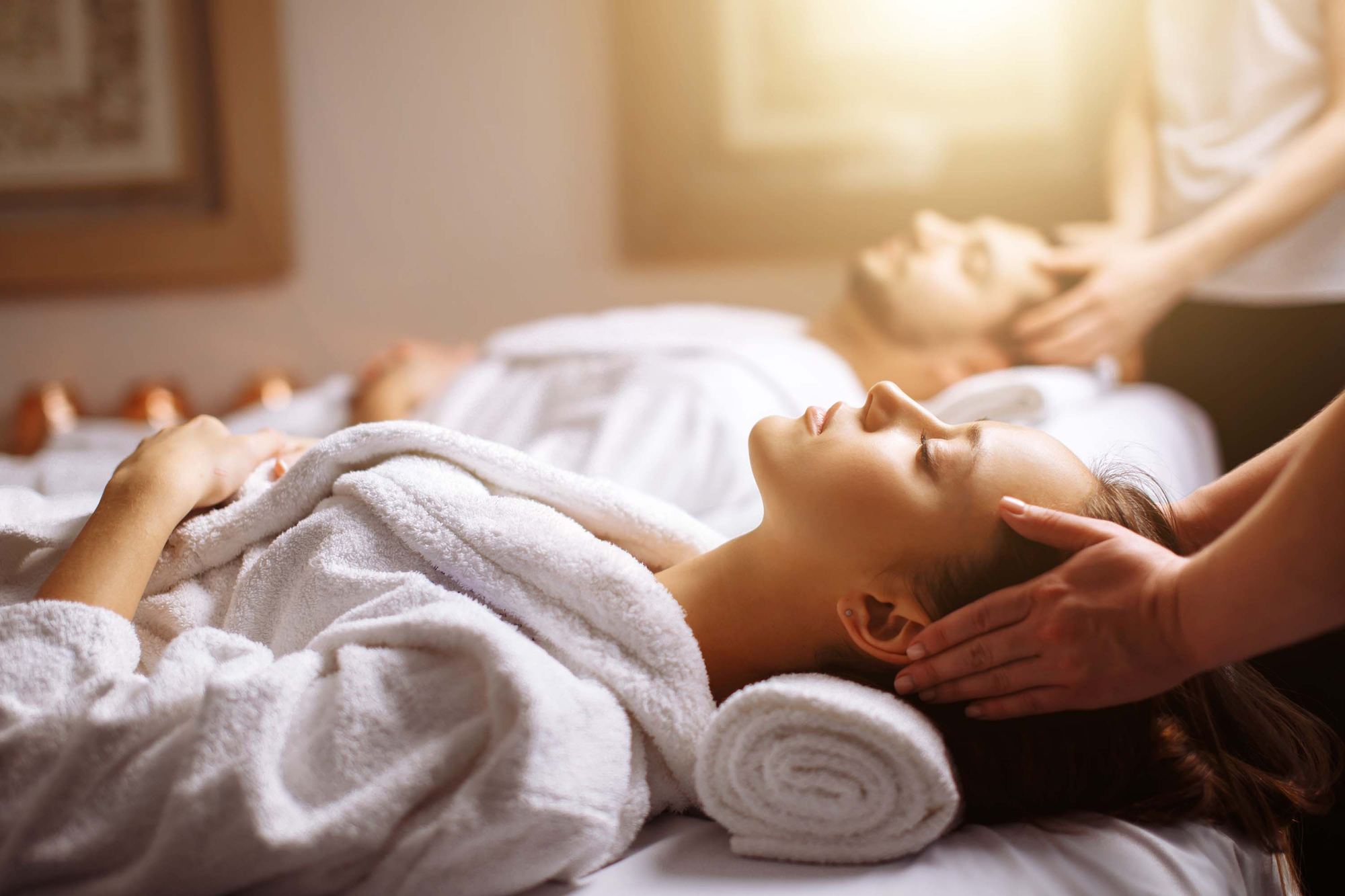 Woman receiving a relaxing scalp massage